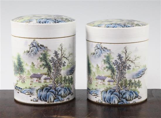 Two Chinese famille rose cylindrical jars and covers, 13cm and 13.5cm